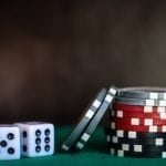 poker chips and dices on a table