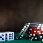 poker chips and dices on a table