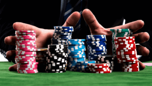a man pushingstacks of poker chips with his hands