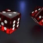 two red dices thrown in the air