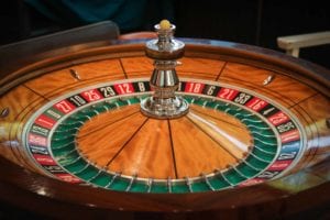wooden roulette wheel with a white little ball