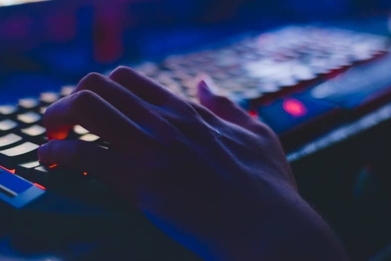 photo of a hand resting on a keyboard