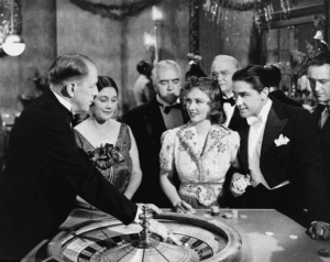 a group of watching the dealer throw the white ball, circa the 1940